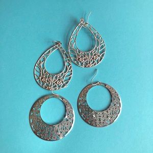 Silver-colored statement earrings